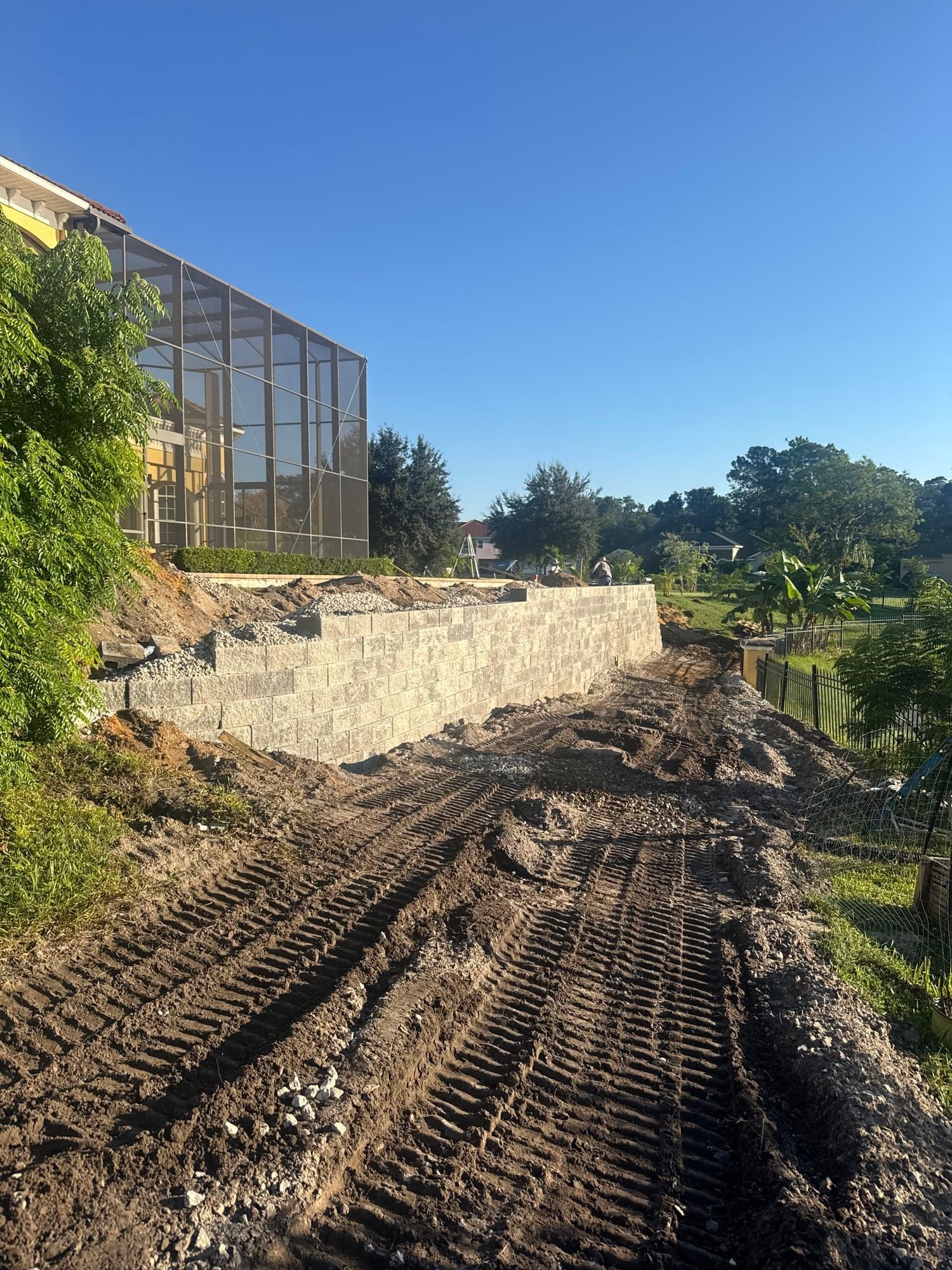 Excavation and grading for a retaining wall