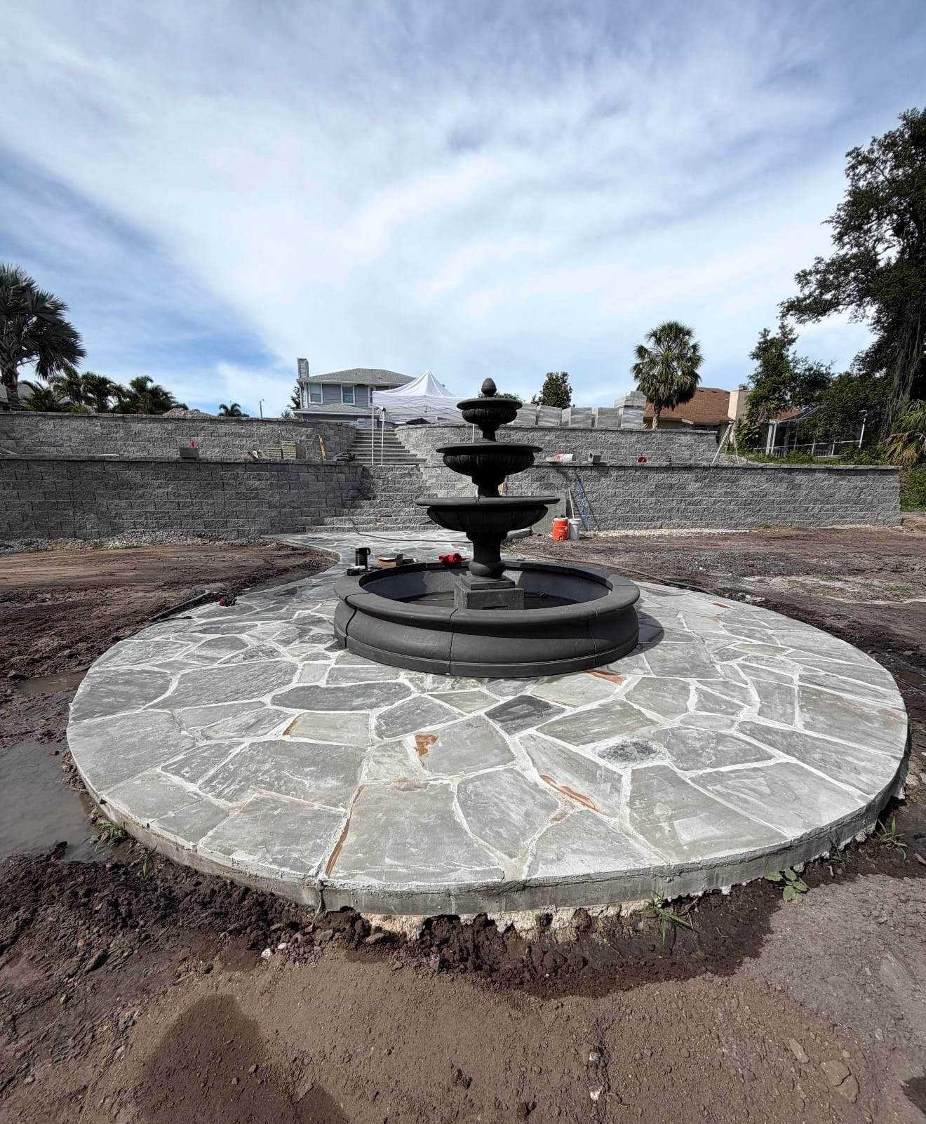 Flagstone patio with a stone fountain