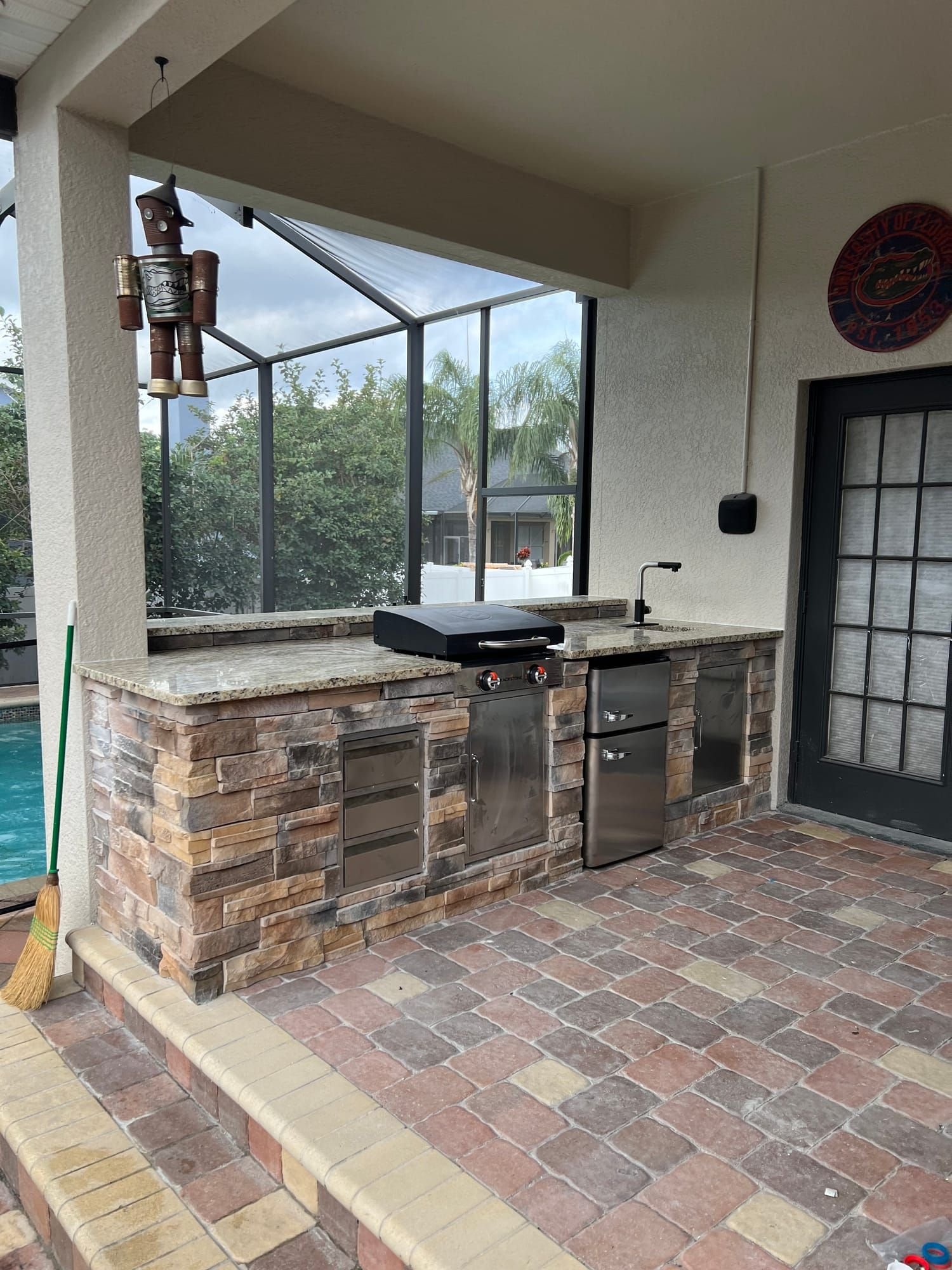 Outdoor kitchen on a paver lanai
