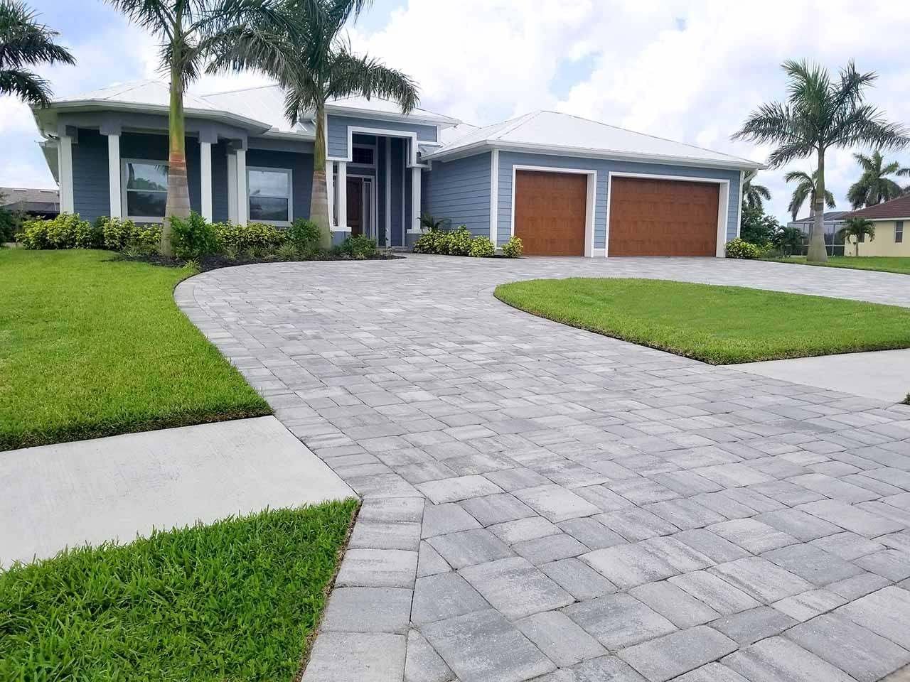 Curved concrete paver driveway in front of a Florida home
