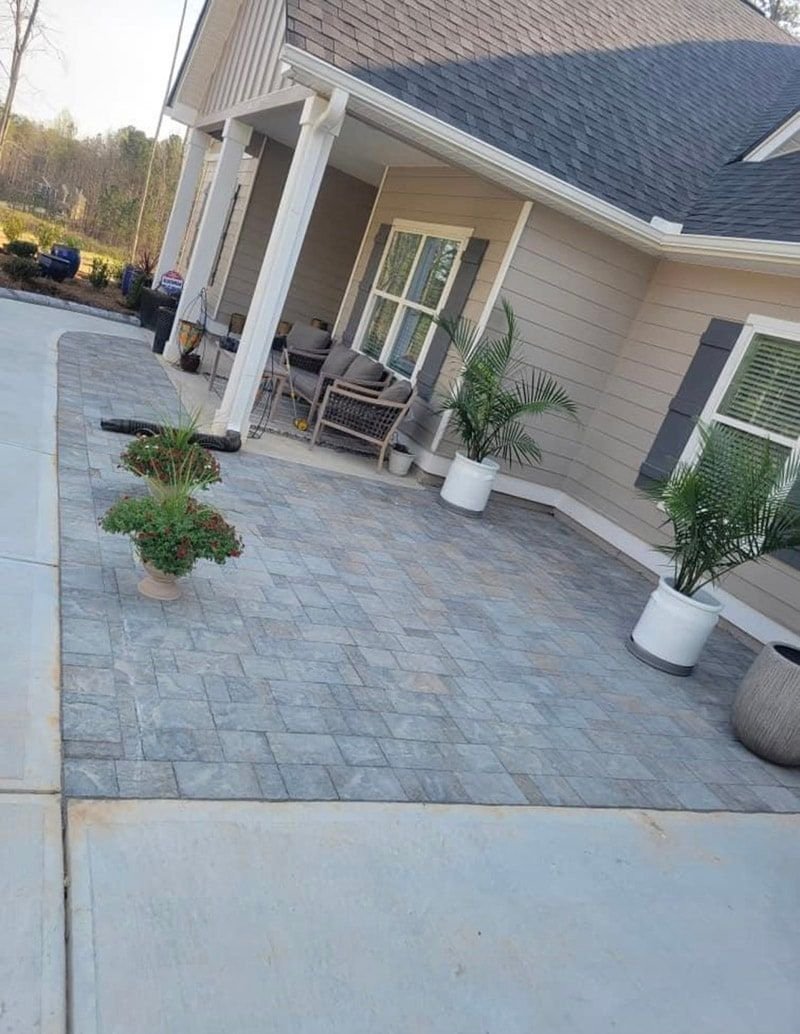 Paver patio extending from a covered lanai